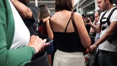 People looking at the mobile while traveling by subway Vídeo Stock 140352011