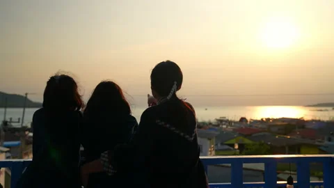 People looking point of view sea and city on sunset sky background Stock Footage 237337699