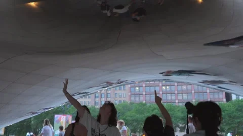 People Looking At Reflections Under Cloud Gate Sculpture In Chicago Stock Footage 336271131