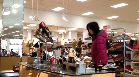People looking a shoes at Sears store Stock Footage 49192666
