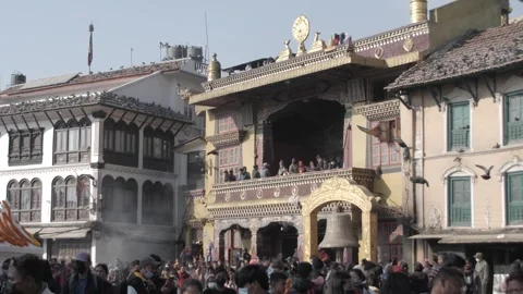 People looking at the stupa from the temples by the side of the stupa. 스톡 동영상 241736099