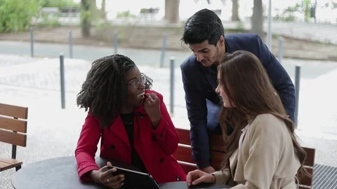 People looking at tablet, finding problem solution, saluting Stock Footage 107847012
