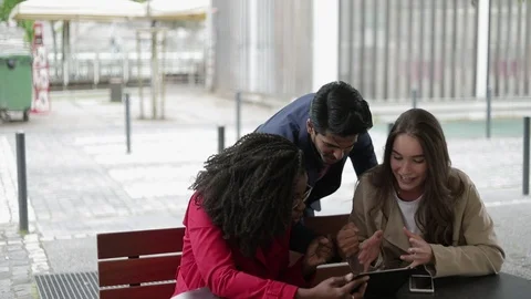 People looking at tablet, finding problem solution, saluting Stock Footage 107847716