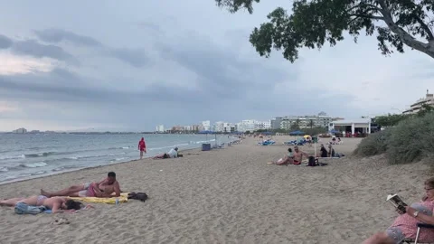 People lying on the beach in Roses Video stock 247454916
