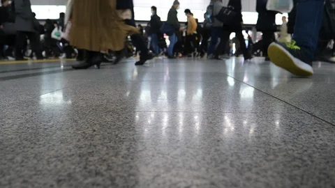 People make their way to work during rush hour at the Shinagawa train station. Stock Footage 109239663