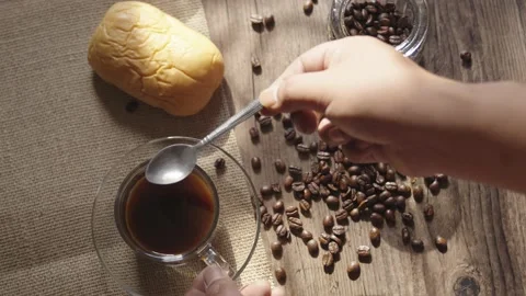 People making coffee in clear coffee cup and coffee beans Stock Footage 227516304