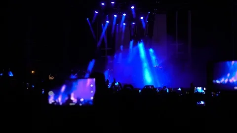 People making video during the concert Stock Footage