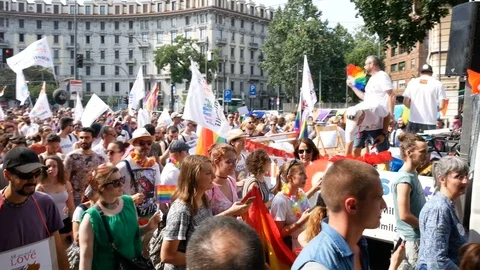 People march at Milano pride parade. 動画素材 79636377