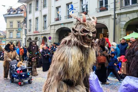People marching and playing instruments during Bern carnival parade in Bern Stock Photos