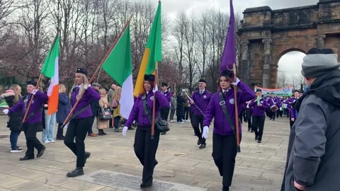 People marching at the Glasgow St Patrick’s Festival Parade at Glasgow Green. Video stock 335323537