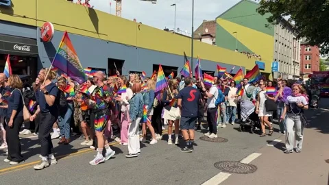 People marching with rainbow flags during Pride Day parade in Oslo Stock Footage 321229208