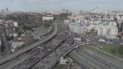 People marching together during a protest against enormous corruption in Serbia Stock Footage 300993883