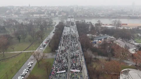 People marching together during a protest against enormous corruption in Serbia Stock Footage 300994000