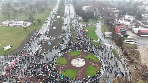 People marching together during a protest against enormous corruption in Serbia Stock Footage 300994008