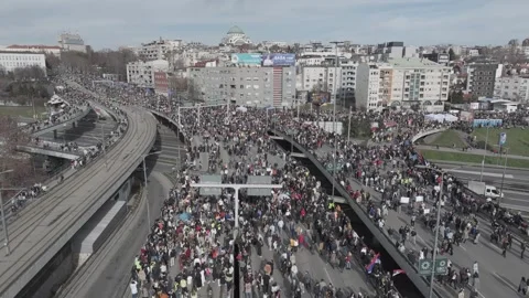 People marching together during a protest against enormous corruption in Serbia Stock Footage 300994011