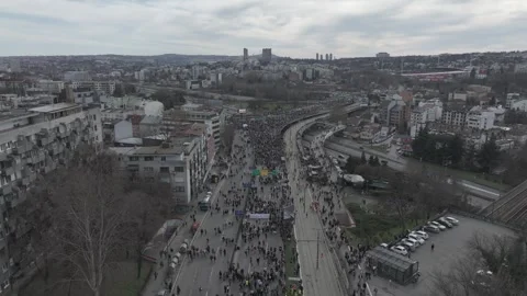 People marching together during a protest against enormous corruption in Serbia Stock Footage 300994042