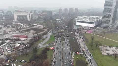 People marching together during a protest against enormous corruption in Serbia Stock Footage 300994489