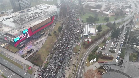 People marching together during a protest against enormous corruption in Serbia Stock Footage 300994674