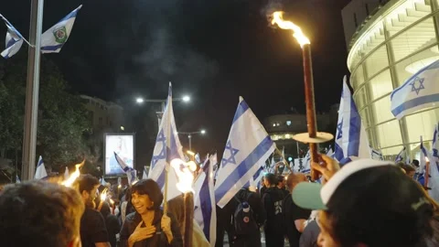 People marching with torches during the protest against Israeli judicial reform Video stock 236199454