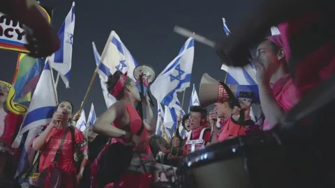 People marching with torches during the protest against Israeli judicial reform Stock Footage 236217834
