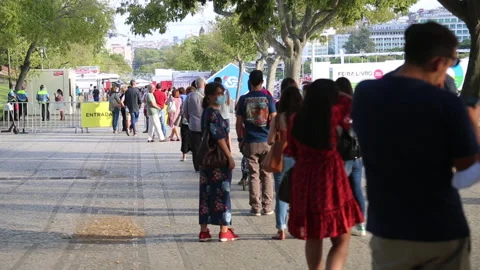 People with mask in security sanitary queue to visit Lisbon Book Fair 2020 Stock Footage 139172813