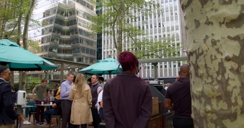 People meet for Drinks after work in outdoor Tavern in the park Stock Footage 193257116
