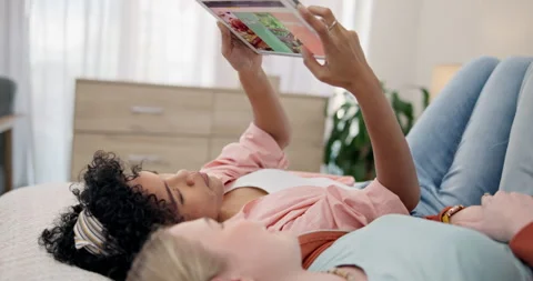 People, menu or tablet to scroll on website for food choice lying on bed to Stock Footage 248698702