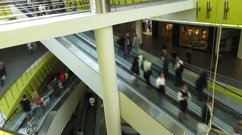 People in motion in escalators at the modern shopping mall Stock Footage 56269341