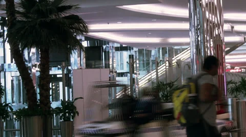 People move on elevators and stairs in an airport. Stock Footage 39790082
