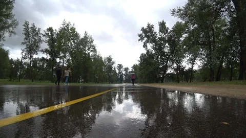 People move in the rain Stock Footage 115842799