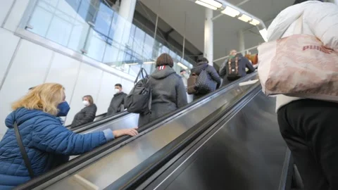 People moving up and down escalator at the airport terminal. Stock Footage 165357679