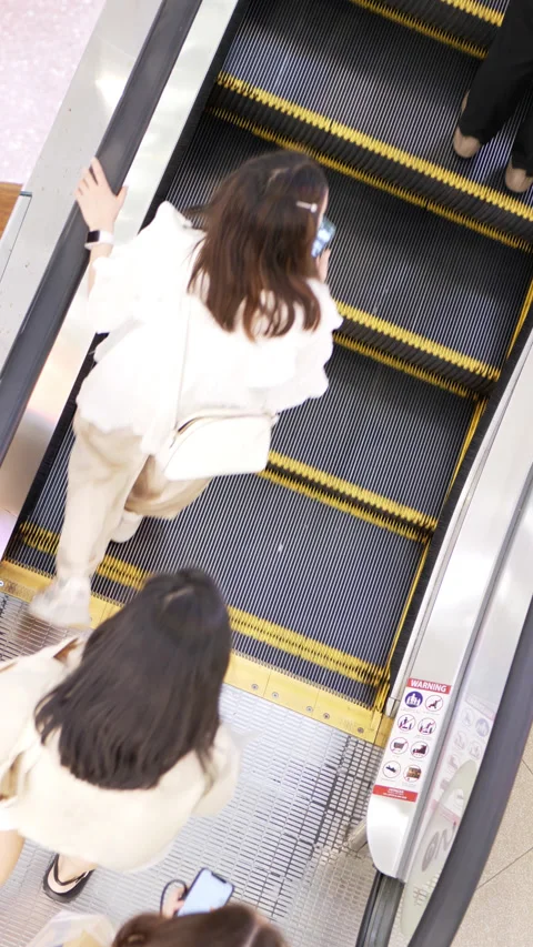 People moving on escalator . Stock Footage 240797435