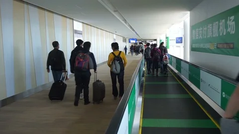 People moving on flat escalators. Stock Footage 87205548