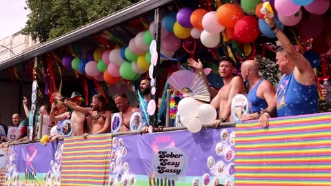 People on moving float Celebrating in Brighton and Hove Pride Parade Stock Footage 281335631