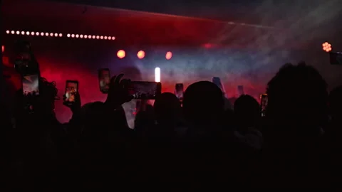 People at music event seen using mobile phones to capture Stock Footage 252723323