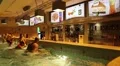 People near bar inside water park HD Footage