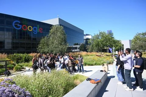 People near the Googleplex  headquarters complex of Google Stock Photos