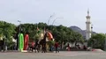 People near monument to the centennial of the Great Arab Revolt in Aqaba, Jordan HD Footage