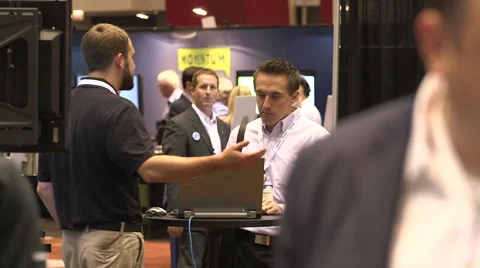 People networking at a tradeshow Stock Footage 49386391