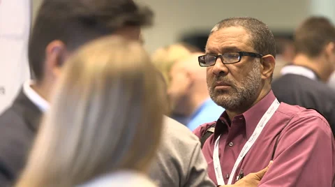 People networking at a tradeshow Stock Footage 49386832