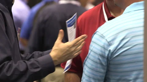 People networking at a tradeshow Stock Footage 49386895
