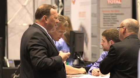 People networking at a tradeshow Stock Footage 49387302