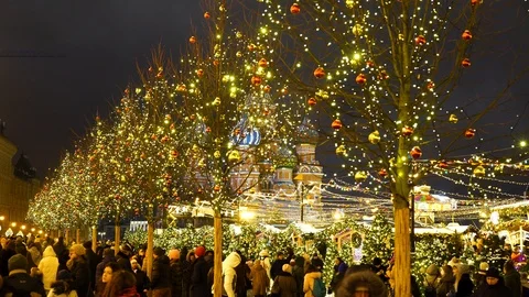 People on the new year fair near the St Basil's Blessed Cathedral Stock Footage 99841853