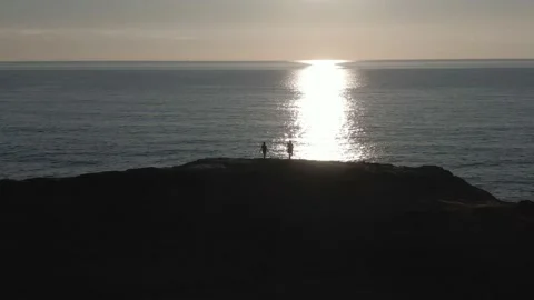 People on Ocean Cliff at Sundown Video stock 141624573