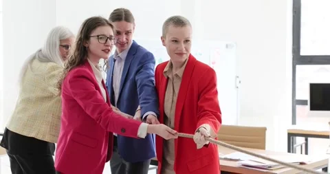People in the office pull the rope together, close-up Stock Footage 243926014