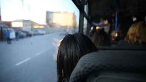 People in old public bus, view from inside the bus . People sitting on a Stock Footage 130094869