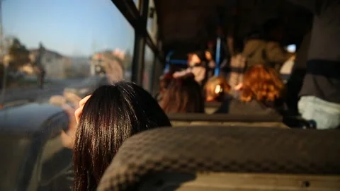 People in old public bus, view from inside the bus . People sitting on a Stock Footage 130866978