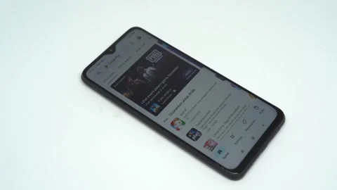 People open the Play Store application on a smart phone Stock Footage 252252446
