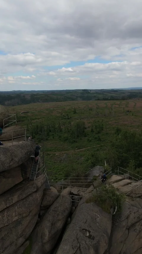 People on the Ottofelsen rock summit vertical Harz Germany Stockbeeldmateriaal 341282916