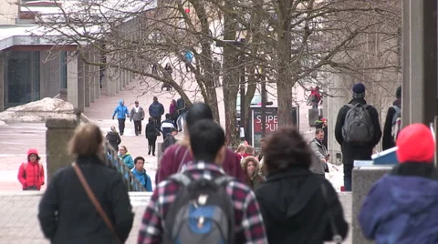 People out on a cold day dressed in winter clothing and coats Stock Footage 48240355